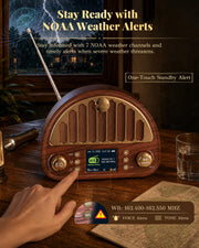 A retro-style wooden radio with a digital display and antenna sits on a wooden table, with a hand pointing at the screen. The scene includes promotional text about NOAA weather alerts, a glass, a map, and a flashlight in a dimly lit indoor setting.