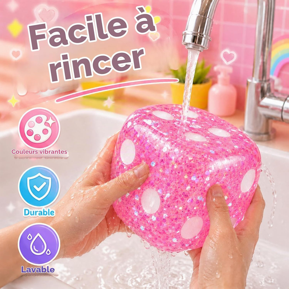 Pink jumbo squishy dice being rinsed under water to show washable design