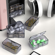 Weekly pill organizer with removable daily medication containers